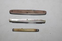 A propelling tooth pick; a mother of pearl cased f