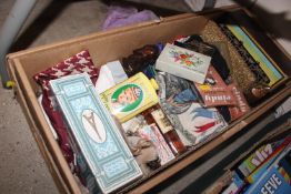 A box of vintage advertising items including perfu