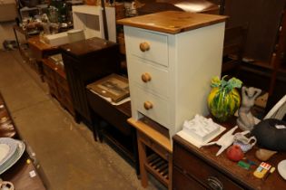 A beech effect bedside table, fitted single drawer