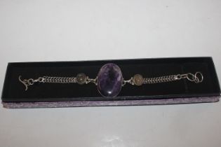 A 925 silver and amethyst coloured bracelet