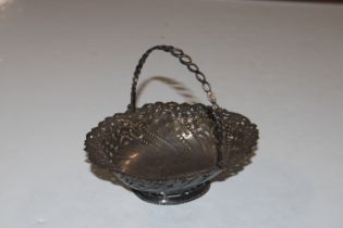 A pierced silver basket with swing handle, approx.