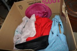 A box of vintage clothes and hats