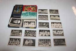 A collection of playing cards and trade cards depi