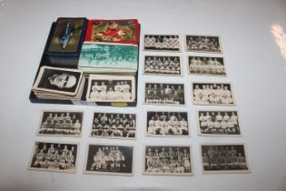 A collection of playing cards and trade cards depi