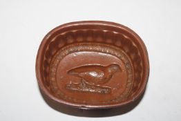 An antique ironstone mould, with quail decoration