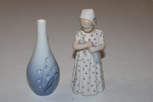 A Copenhagen figurine in the form of a young girl; and a Copenhagen porcelain vase