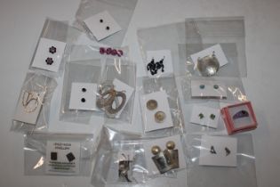 An amethyst coloured ring; and a box containing various ear-rings