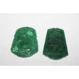Two carved jade coloured pendants