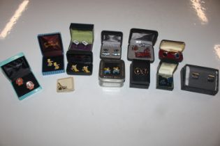 A box of various cuff-links