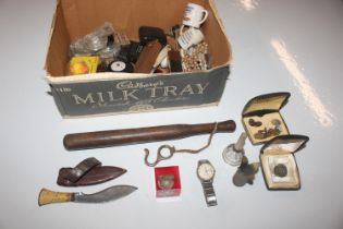 A box containing fishing Priest; shell case; and various small sundry items