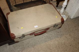 A leather bound and canvas military trunk dated 19
