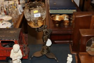 A bronzed figural table lamp