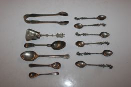 A set of six white metal spoons with cherub decora