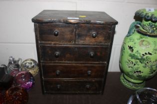 A stained pine chest, fitted two short over three