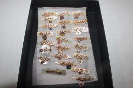 A box containing mother of pearl and rolled gold brooches