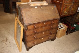 A 19th Century oak bureau fitted four drawers
