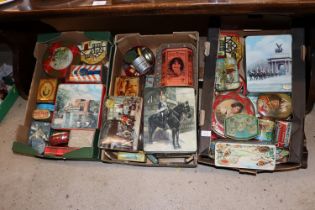 Three boxes of various advertising tins