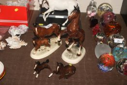 Two Haring Pottery model horses ; and two Royal Do