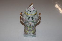 A Dresden twin handled vase and cover with pierced decoration and a Dresden cup and cover with