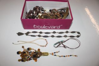 A box containing various Eastern style jewellery ,
