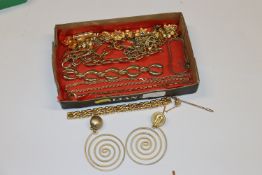 A tray of gilt metal necklaces