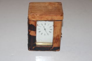 A brass cased carriage clock with travelling case