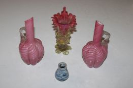 Two Art Glass ewers; a coloured glass Jack In The Pulpit style vase; and a small pottery vase