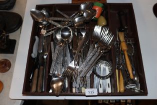 A tray of various cutlery