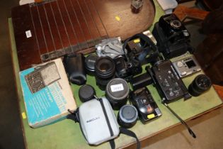 A collection of cameras and lenses