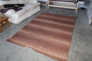 An approx. 8'3" x 5'6" modern patterned rug AF