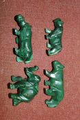 A collection of malachite carvings of animals