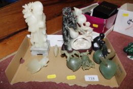 A collection of polished stone carvings to include