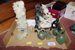 A collection of polished stone carvings to include