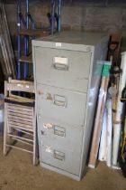 A metal four drawer filing cabinet