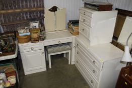 A modern dressing table with stool; three drawer c