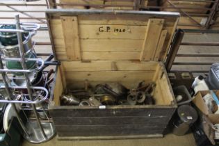 A wooden storage trunk and contents of various met