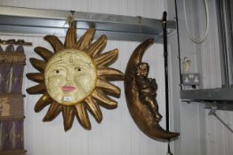 Two wall hangings in the form of the sun and the m