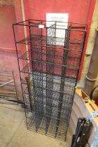 A black painted wire metal storage rack