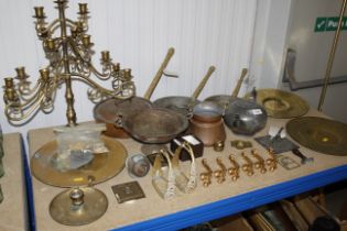 A collection of metalware to include brass plates;