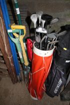 A quantity of golf clubs including woods, irons an