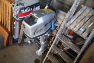 A Honda four stroke outboard motor