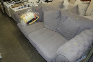 A button down upholstered settee