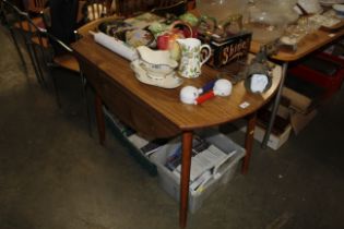 A drop leaf kitchen table