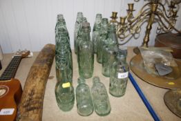 A collection of old glass advertising bottles