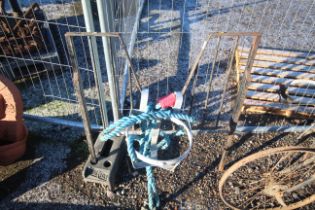 A stable door grill, tow rope and galvanised feed