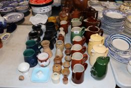 A collection of Denby and other coffee pots; stone