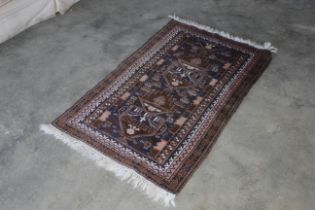 An approx. 4'6" x 2'9" blue and brown Eastern patt