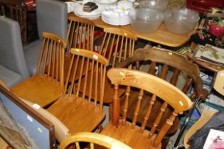 A set of four Ercol style stick back chairs; a pin