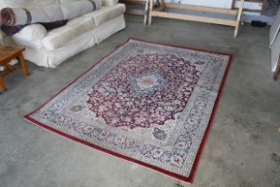 An approx. 7'7" x 5'7" floral patterned rug