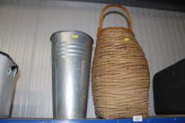 A wicker basket and galvanised vase